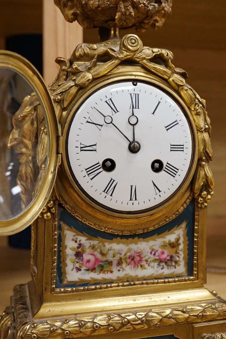 A 19th century French ormolu mantel clock with email dial and hand painted panels, with pendulum, no key, 39cm high